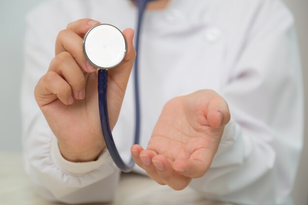 Close-up of hands with stethoscope