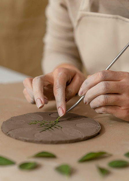 Close-up hands working with plant