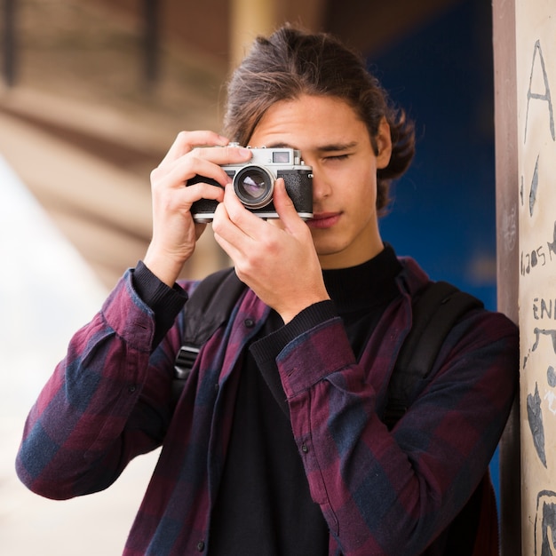 Close-up handsome man taking a picture