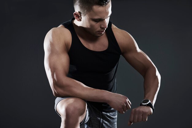 Close up on handsome young man working out