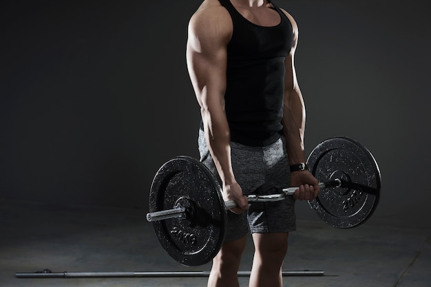 Close up on handsome young man working out