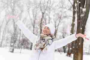 Free photo close up on happy adult playing in the snow