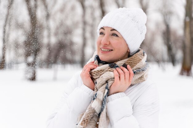 Close up on happy adult playing in the snow