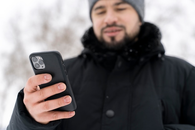 Free photo close up on happy adult playing in the snow