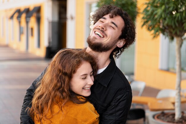 Close up happy couple hugging