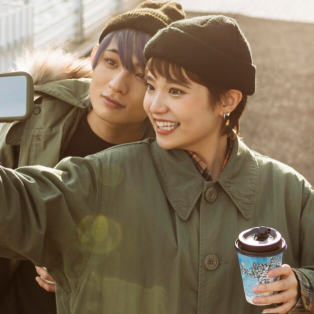 Close-up happy couple taking selfie