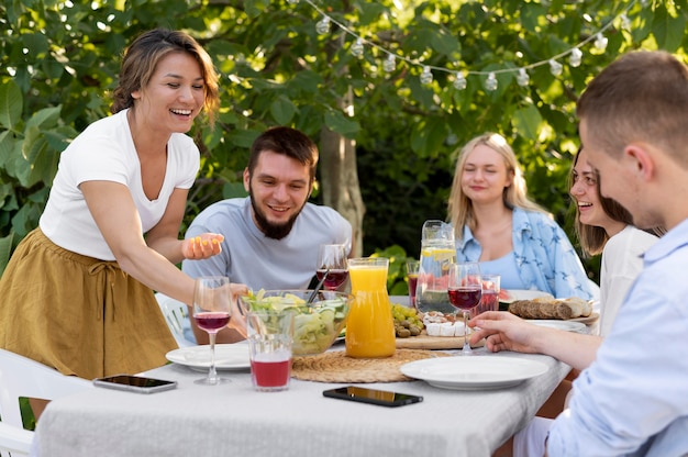 Free photo close up happy friends at table