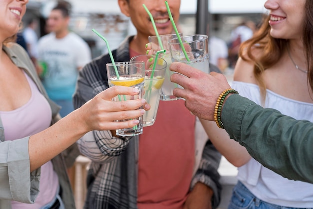 Close-up happy friends toasting