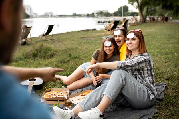 Close up happy friends with pizza