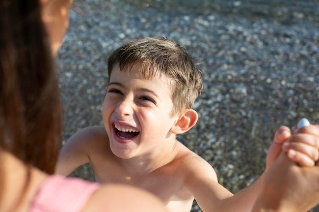 Close up happy kid at seaside