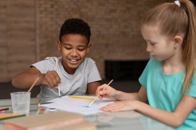 Free photo close up happy kids painting