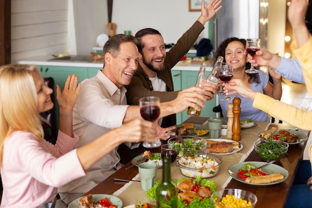 Free photo close up happy people at table