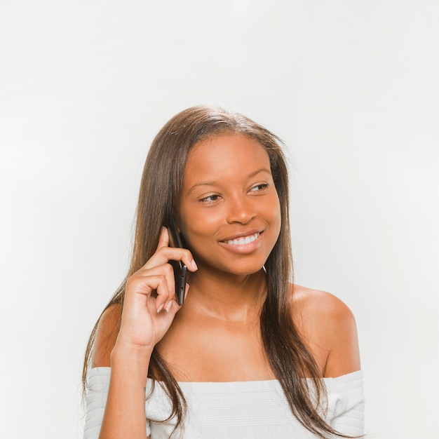 Free photo close-up of a happy teenage girl talking on cellphone