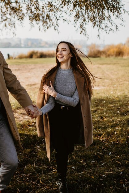 Close-up happy woman holding partner