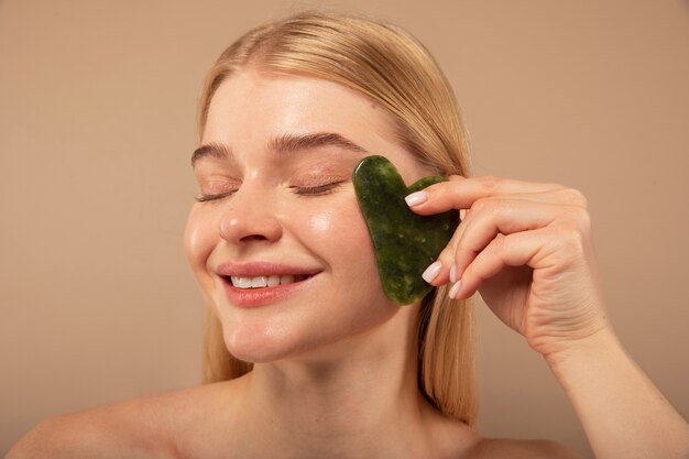 Close up happy woman holding tool