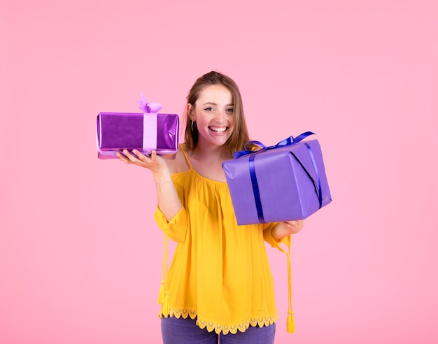 Free photo close-up of happy woman holding two gift boxes