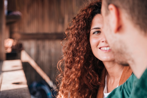 Free photo close-up happy woman looking at man