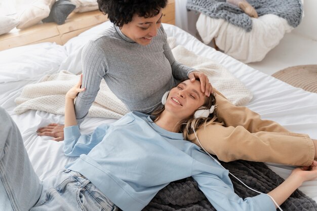 Close up happy women in bed