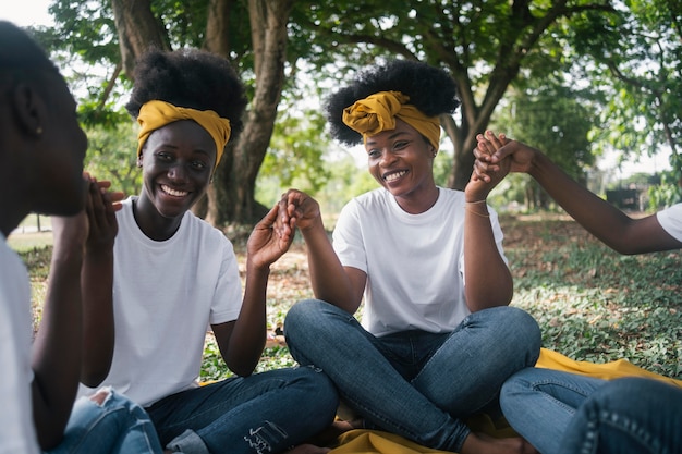 Free photo close up happy women holding hands