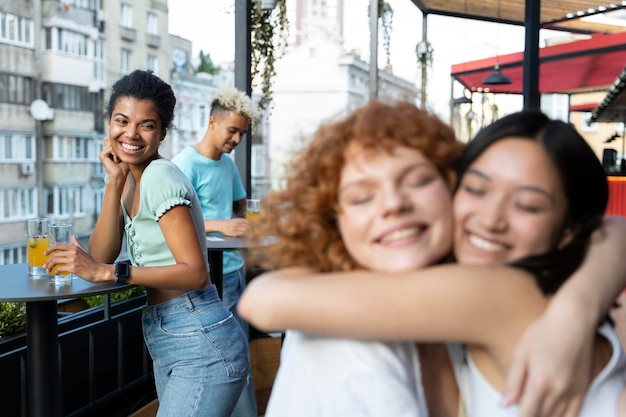 Close up happy women hugging