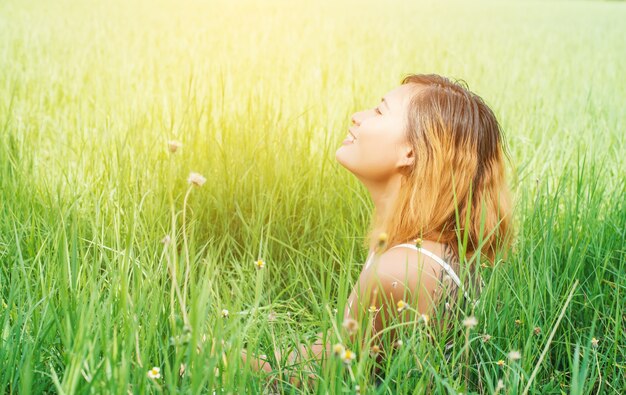 Close-up of happy young woman enjoying the fresh air