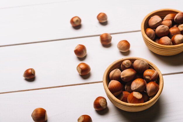 Close-up hazelnuts in bowls