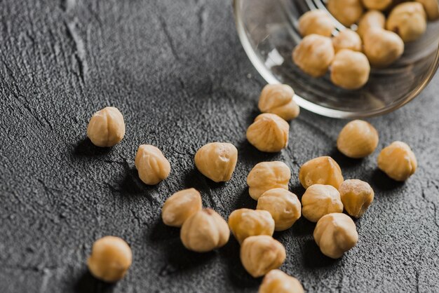 Close-up hazelnuts near glass