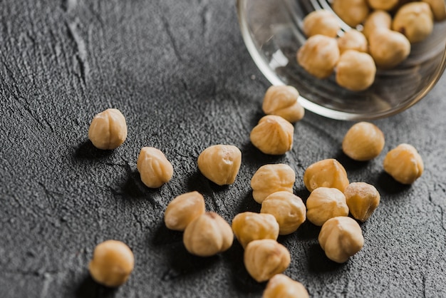 Close-up hazelnuts near glass