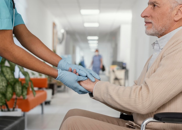 Free photo close up health worker helping patient