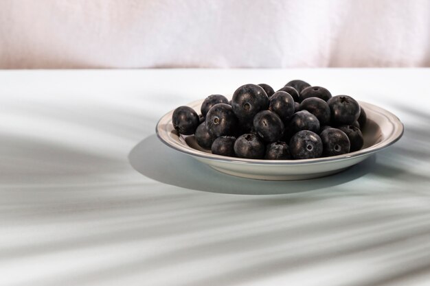 Close-up of healthy blue berries on plate