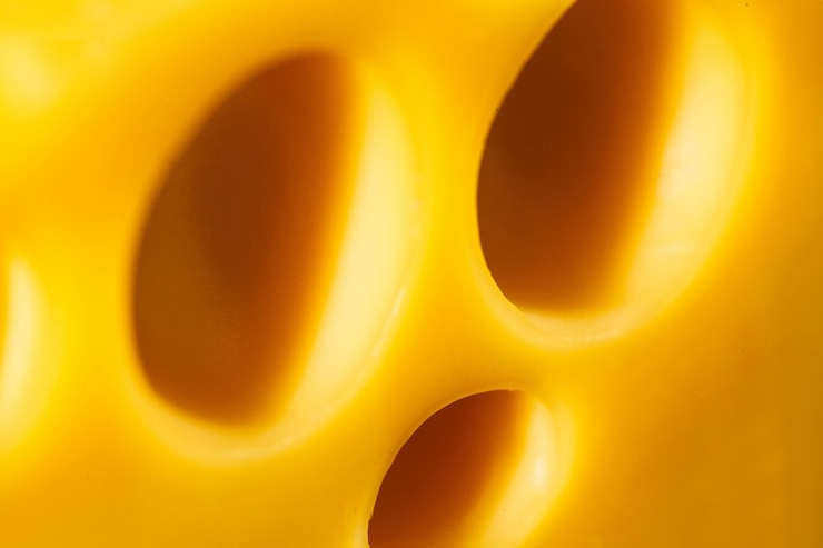 Free Photo close-up of holes in swiss cheese