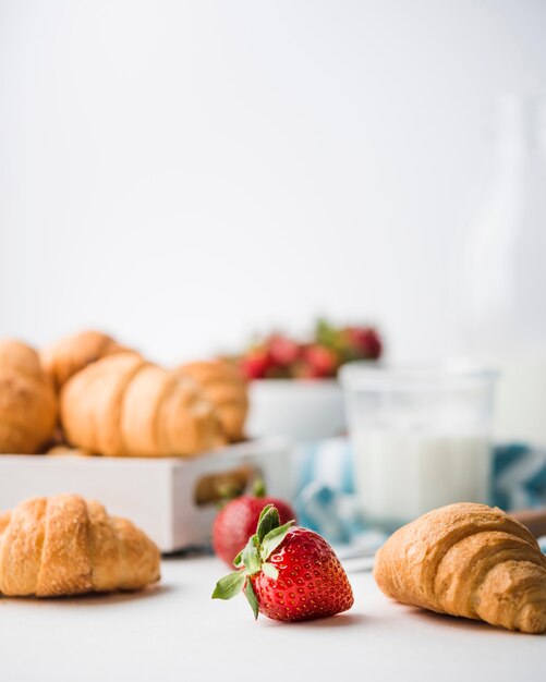 Close-up homemade croissants with strawberries