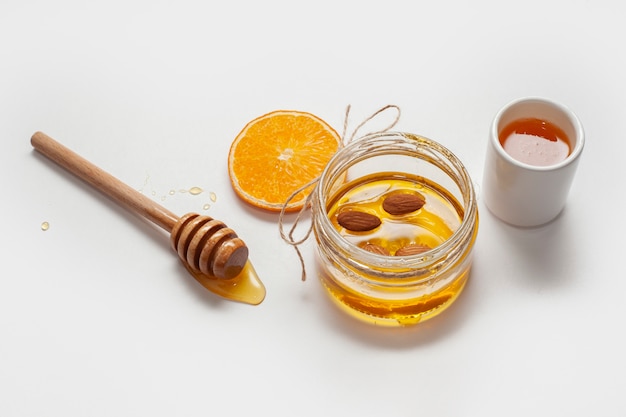 Close-up homemade honey with orange