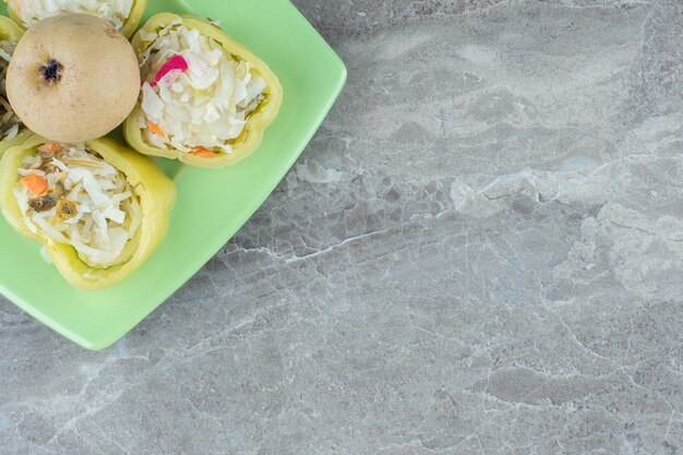 Close up of homemade pickle on green plate 