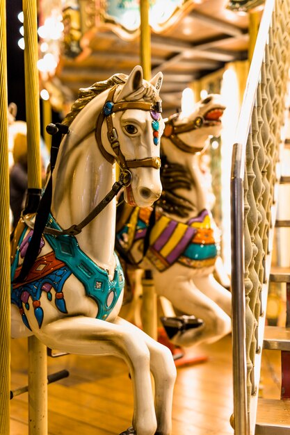 Close-up of horse ride in carousel at amusement park
