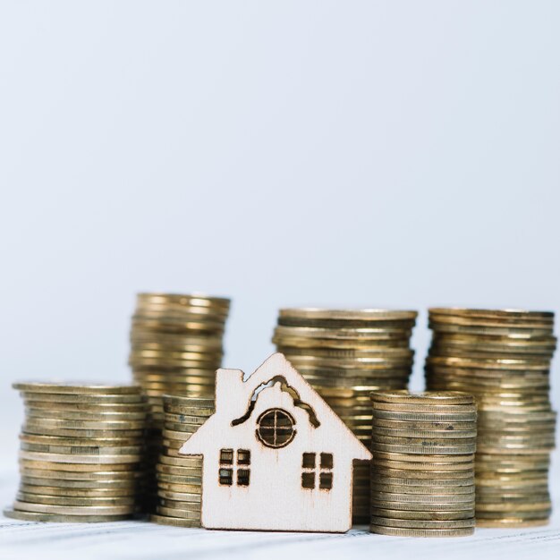 close-up house near coins