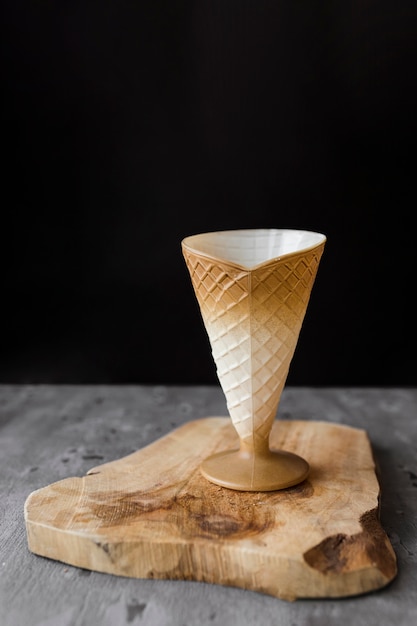 Close-up ice cream cone on wooden board