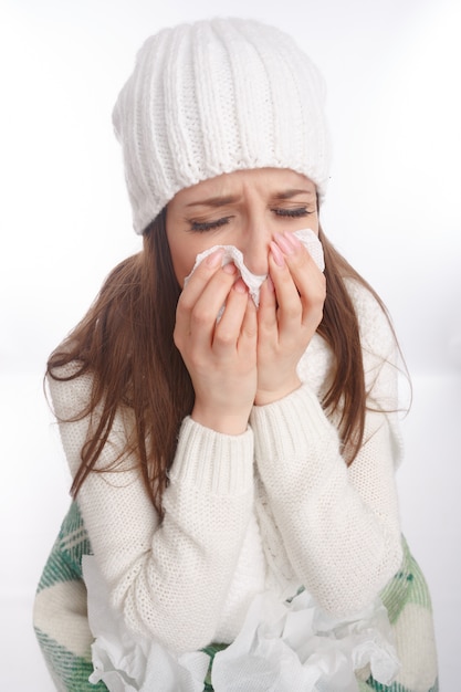 Free photo close-up of ill girl blowing her nose