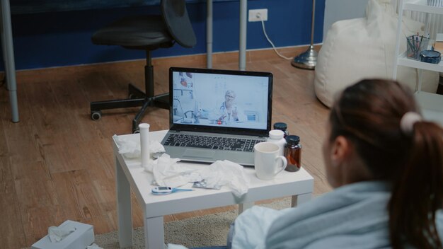 Close up of ill patient using video call for telemedicine