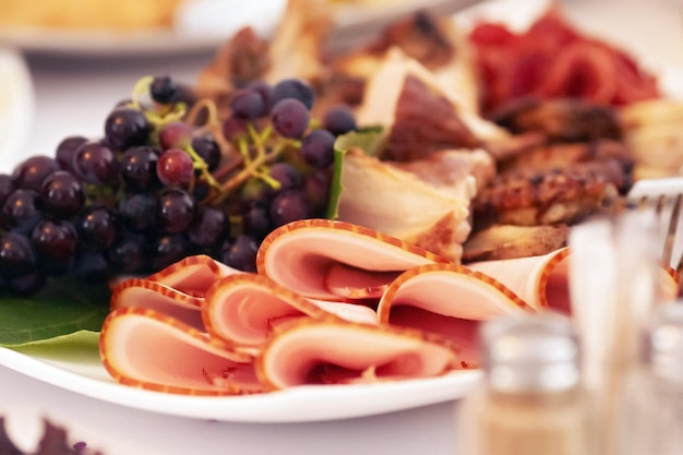 Close-up image of a festive table with different dishes. Festive event, party or wedding reception.