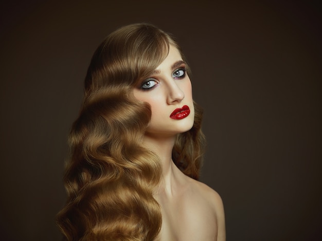 Close-up indoor portrait of lovely girl with colorful hair. Graceful young woman with long haircut