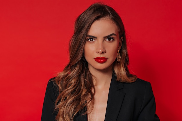 Close up indoor portrait of spectacular stylish woman with evening make up and celebrating Valentine's day