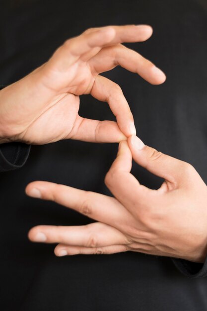 Close-up interpreter teaching sign language