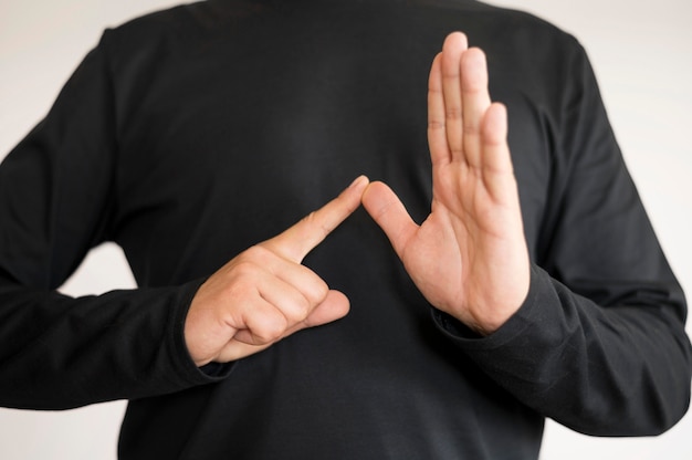 Close-up interpreter teaching sign language