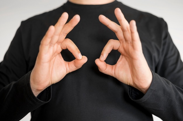 Close-up interpreter teaching sign language