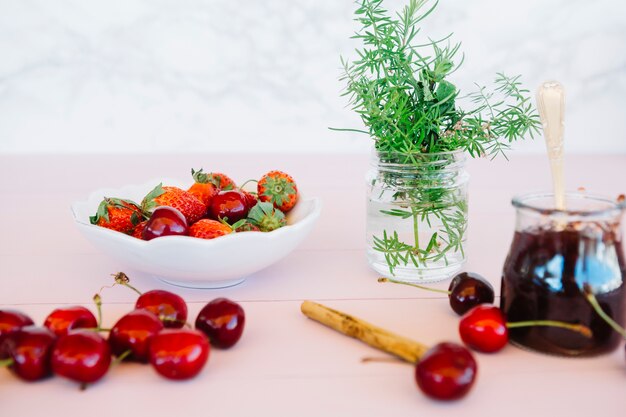 Close-up of jam with ingredients on table