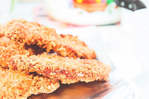 Close up of Japanese food, homemade Tonkatsu Pork cutlet on aluminium foil with copy space