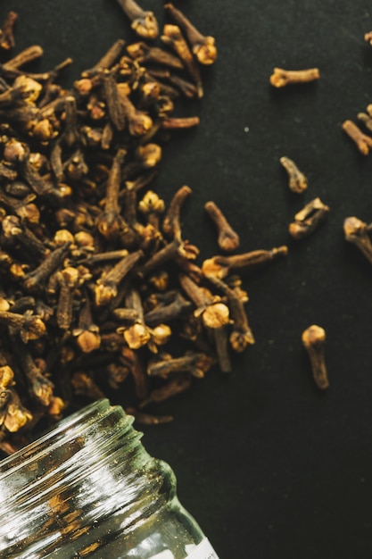 Close-up jar and cloves