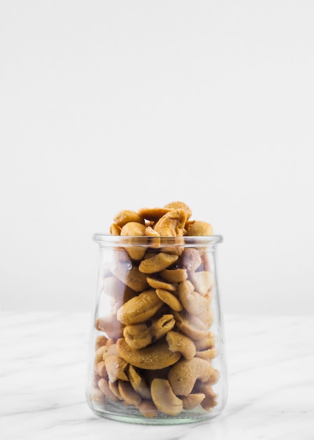 Close-up of jar filled with fresh cashewnuts