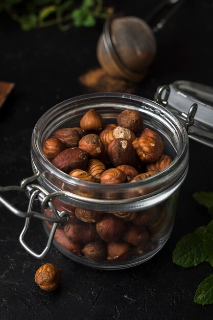 Close-up jar filled with hazelnuts